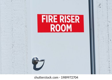 Fire Riser Room sign on the door leading to dedicated space for fire protection equipment.