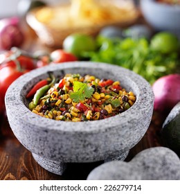 Fire Roasted Corn And Black Bean Salsa In Stone Molcajete