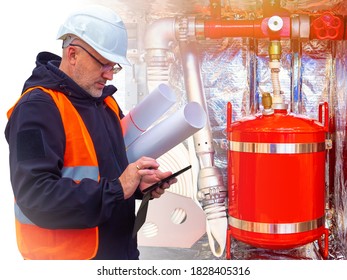 Fire Safety. Checking Fire-fighting Equipment. A Safety Engineer Checks Fire Extinguishers And Hoses.