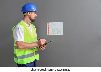 Fire Safety Specialist Inspecting Building