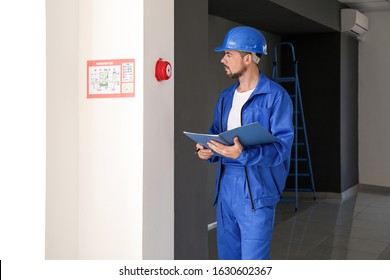 Fire Safety Specialist Inspecting Building