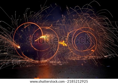 A fire show with elements of fireworks. Entertainment for children and adults. Animators with a dance program.