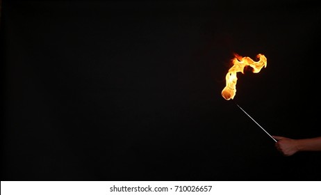 Fire show performance. A man picks gasoline at a torch, slow motion.