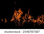 Fire sparks background. Abstract dark fire flames background. Background of flames blazing. Blaze flames background with copy space. Burning fire concept.