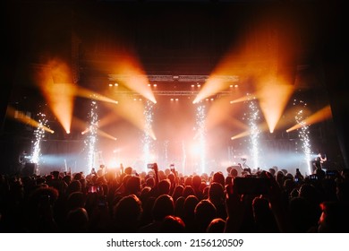 Fire sparks on a concert in front of  the crowd - Shutterstock ID 2156120509