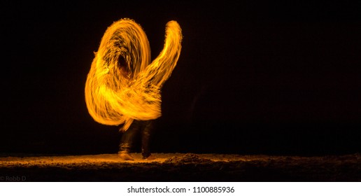 Fire Spinner On The Beach