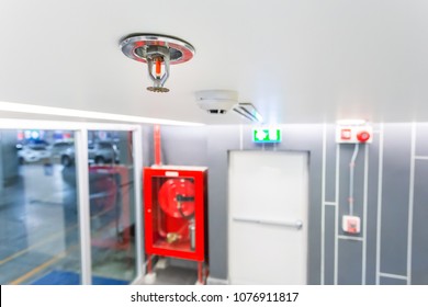 Fire Sprinkler, Focus At Selective, Fireplace In The Office For Safety And To Reduce Damage In Case Of Fire, Signage Exit Blur Background.