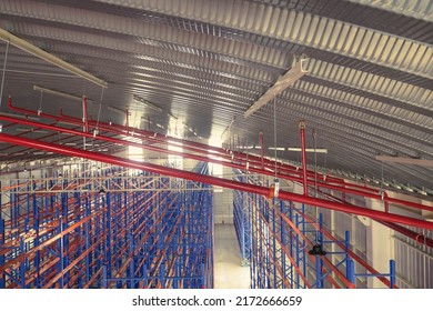 Fire Sprinkler And Red Pipe.Install Fire Sprinkler System. In The Industrial Plant Warehouse, Pipe Assembly, Red Fire Pipe, Fire Protection Contractors Using Scissor Lift High Work