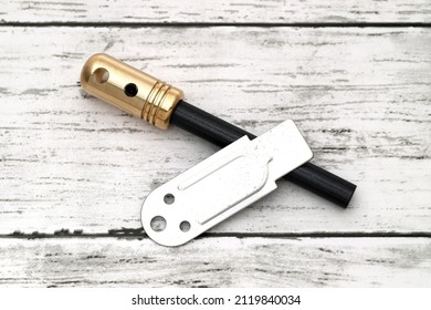 Fire Starter, Camping Equipment On White Wooden Background