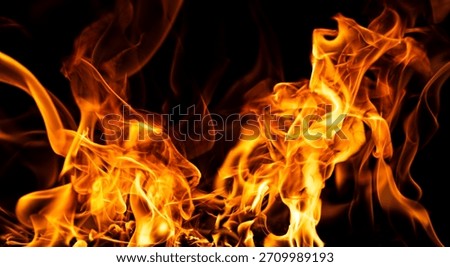 Fire texture. Flames with dramatic fire background. Burning flame. Fire abstract background with flame. Intense burning fire texture for overlay layer effects. Fiery explosion background.