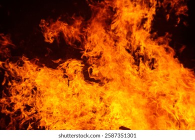 fire texture on black background, large fire photographed at night