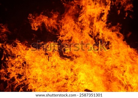 fire texture on black background, large fire photographed at night