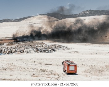 Fire In A Tire Dump. Heavy Black Smoke From Burning Old Tires