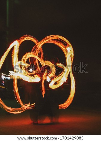 Fire torches during a fireshow artist's performance
