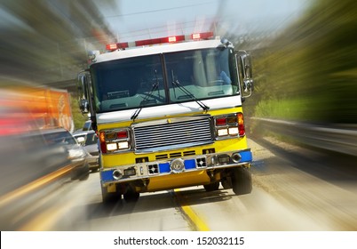 Fire Truck In Action - California, USA. Fire Department At Work. Flashing Lights Of Fire Truck. Transportation Collection.