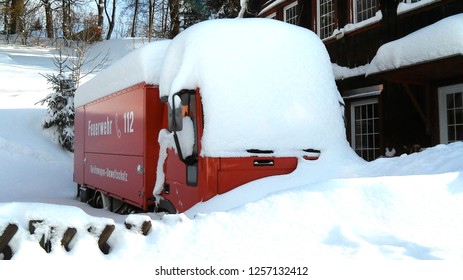 Fire Truck Covered With Snow.