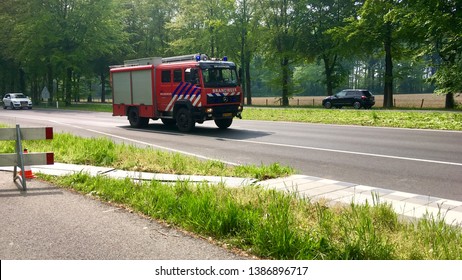 Fire Truck Driving With Flashing Lights. On A Road In Arnhem Gelderland The Netherlands 2 May 2019