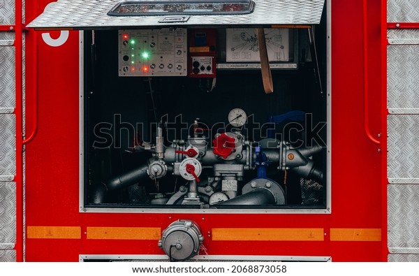 Fire truck\
equipment. Foam tank, water pipes, pumps. Red car emergency vehicle\
. Kazan, Russia. 02 November 2021.\
