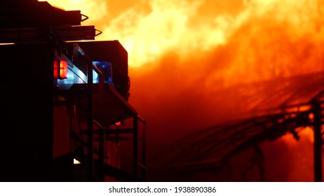 fire truck and flasher fire engine. fire on the roof of the house. a burning at building night house. home apartment insurance concept. huge fire blazes houses 911. property damage arson protection - Powered by Shutterstock