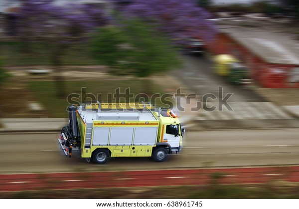 fire truck at full\
speed to the rescue