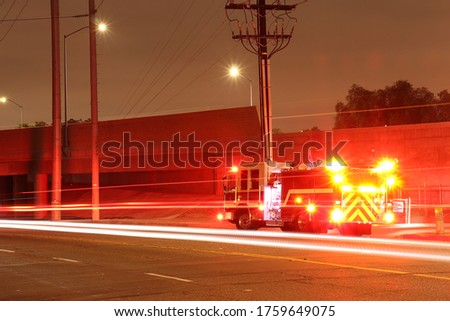 Fire Truck with Lights on at Night