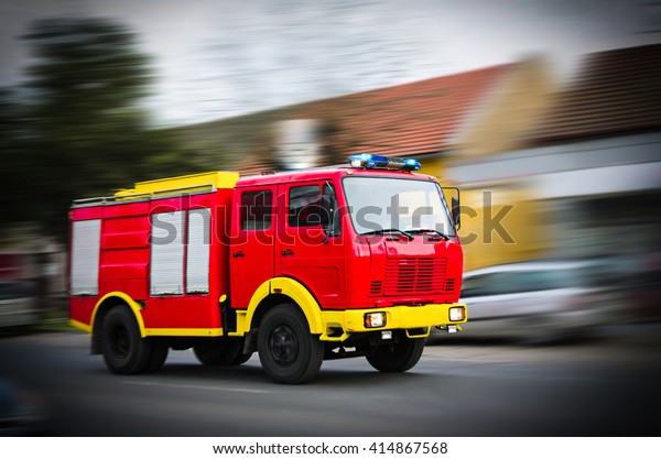 Fire Truck in situation with flashing lights,\
blurred motion