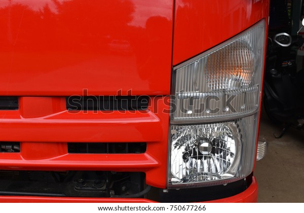 The fire truck\'s red\
headlights.