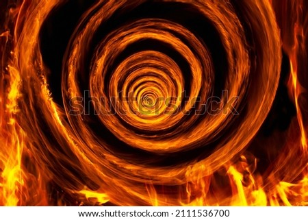 Fire vortex made with real fire and captured with long exposure. Abstract concept of the road to hell for a soul.