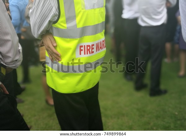 Fire\
warden man in the training of emergency fire drill\

