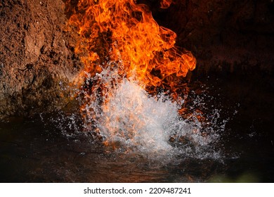 Fire And Water. Gas That Burns Directly From The Ground Passing Through The Water Table. Burning Natural Gas.