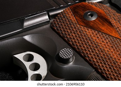 Firearm close up with rosewood grips