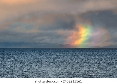 Firebow on the Moray Firth. The stack of colors is known as a circumhorizon (or circumhorizontal) arc—or, sometimes, a “firebow.”