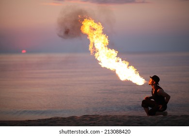 Fire-breathing demonstration on the beach