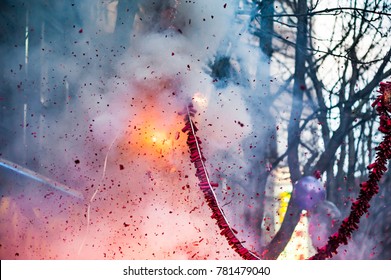 Firecrackers exploding in the street for the chinese new year celebration