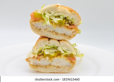 Fired Catfish Po Boy Sandwich Cut In Half With A White Background