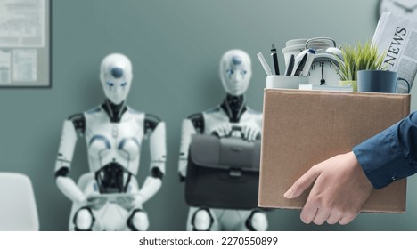 Fired office worker holding a box with her belongings and leaving the office, humanoid AI robots waiting for a job interview i: the impact of artificial intelligence and robotics on unemployment - Shutterstock ID 2270550899