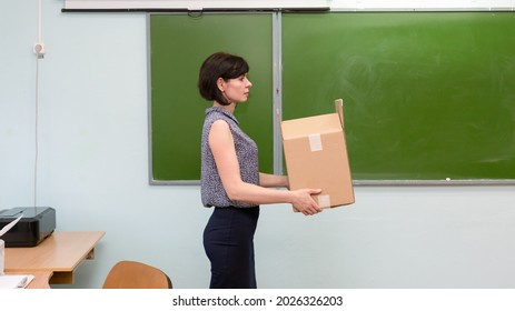 Fired Sad Teacher Leaves School Office With A Box Of Things.