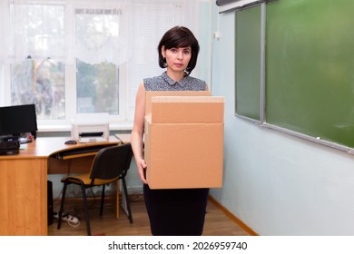 Fired Sad Teacher Leaves The School Office With A Box Of Things.