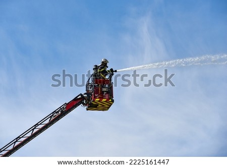 firefighter in action on the large scale	