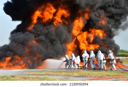 Firefighter Battle With The Wildfire. Firefighters Are Training. Firemen Are Using Water In Fire Fighting Operation.