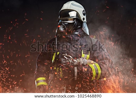 A firefighter dressed in a uniform in a studio.