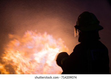 firefighter with fire background