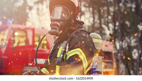 Firefighter In Fire Fighting Operation, Fireman In Protective Clothing And Helmet With Equipment In Action Fighting