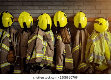 Firefighter - Firefighting gear including helmets, gloves, jacket and trousers among other clothing and equipment in fire station - Powered by Shutterstock