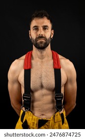 Firefighter from the front posing in photo studio