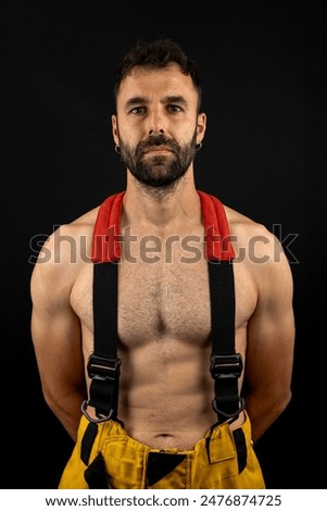 Firefighter from the front posing in photo studio