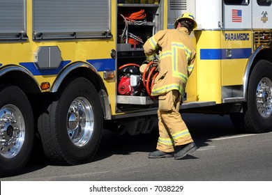 Firefighter Getting Equipment From His Fire Truck