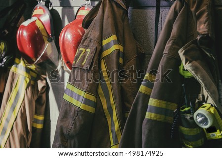 Firefighter hanging, ready for call