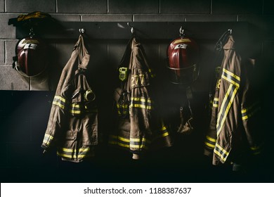 Firefighter hanging suit in a dark room