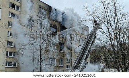 firefighter helping down fire in apartment 